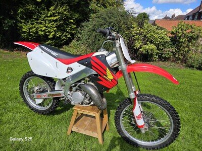Cr 125